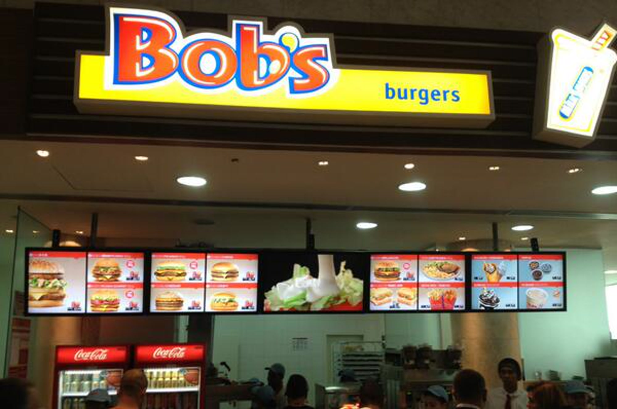 Bob's restaurant counter with a wide row of digital menu boards