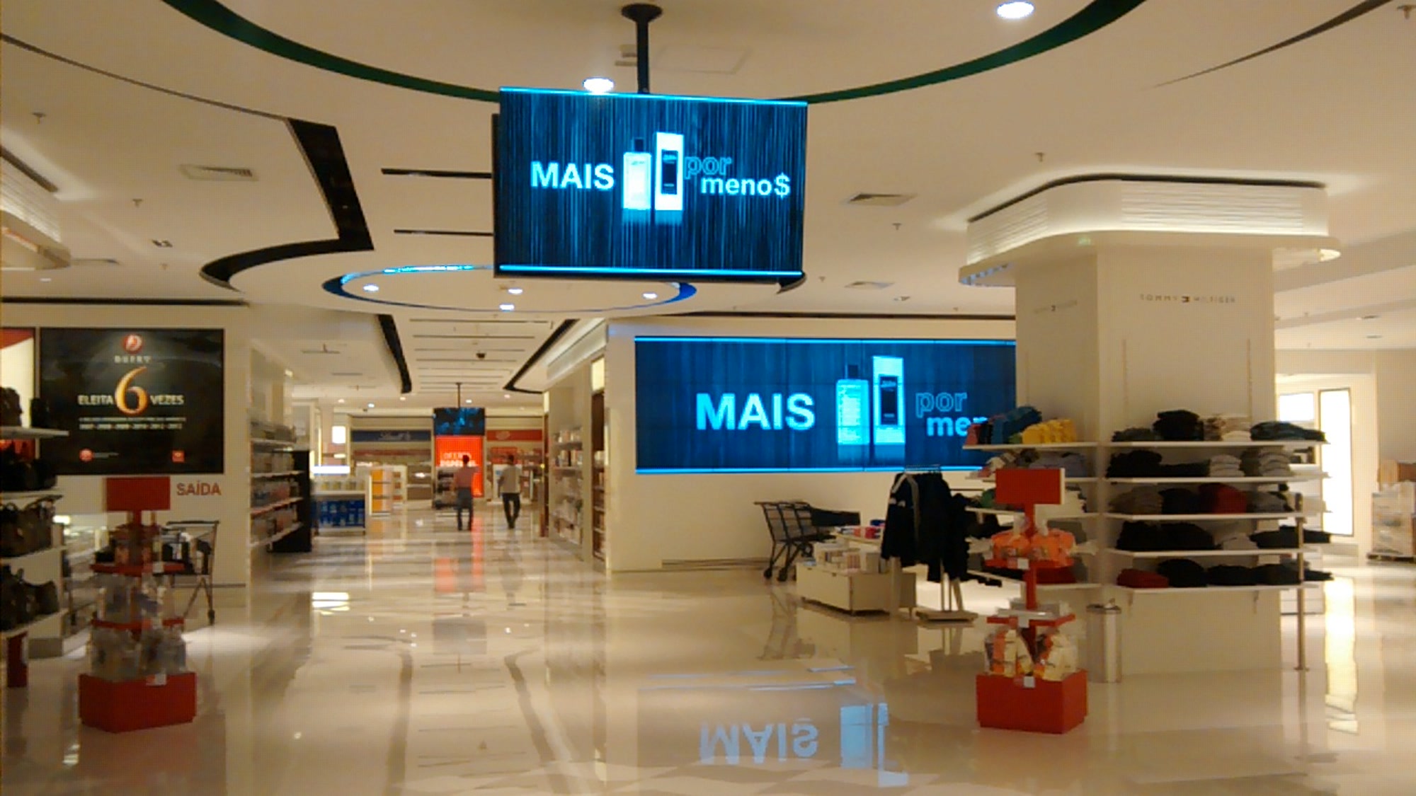 Dufry store interior with two suspended digital communication displays